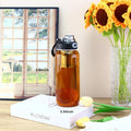 34oz tea bottle with infuser - Large Capacity Glass Water Bottle, With Time Mark, Stainless Steel Tea Strainer,Sleeve, BPA Free,For hot or cold