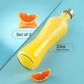 Joyjolt Glass Water Bottles - 2Pc Set, 32 Oz/1 Liter, Clear Glass with Stainless Steel Lids, Leakproof, Ideal for Juicing or Iced Tea